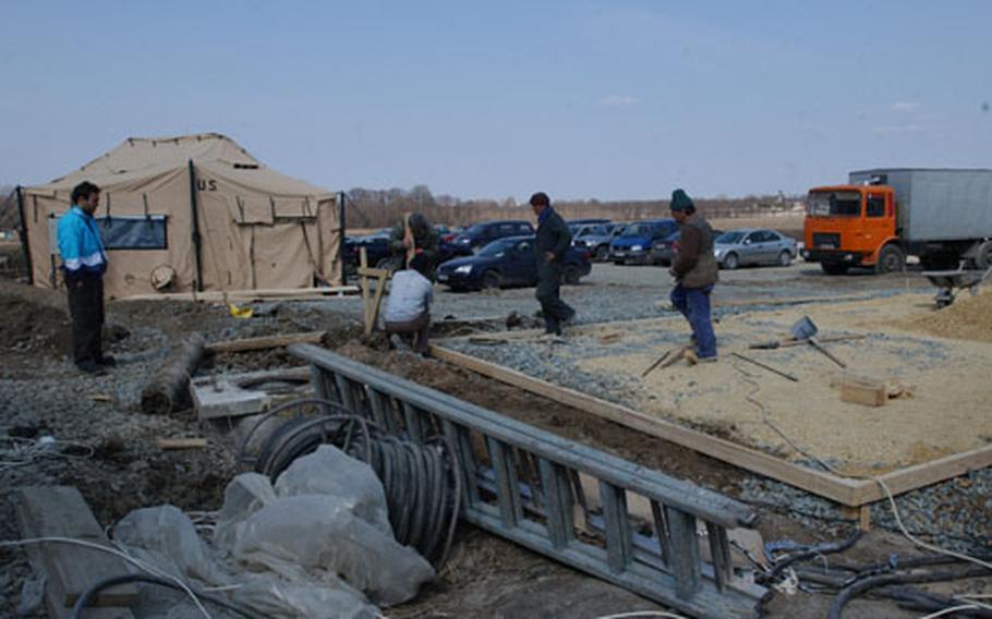Workers are upgrading a base in Constanta, Romania, used by U.S. Air Force troops for an air bridge bringing supplies and personnel to support Operation Iraqi Freedom.