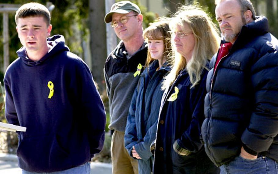 Gregory Lynch Jr., brother of ex-POW Jessica Lynch, talks to the press in front of the Fisher House at Landstuhl, Germany. Lynch and his father Gregory Sr., right, answered questions about Jessica's condition and their reunion with her. Joining them were Jessica Lynch's mother Deadra, sister Brandi and cousin Dan Little.