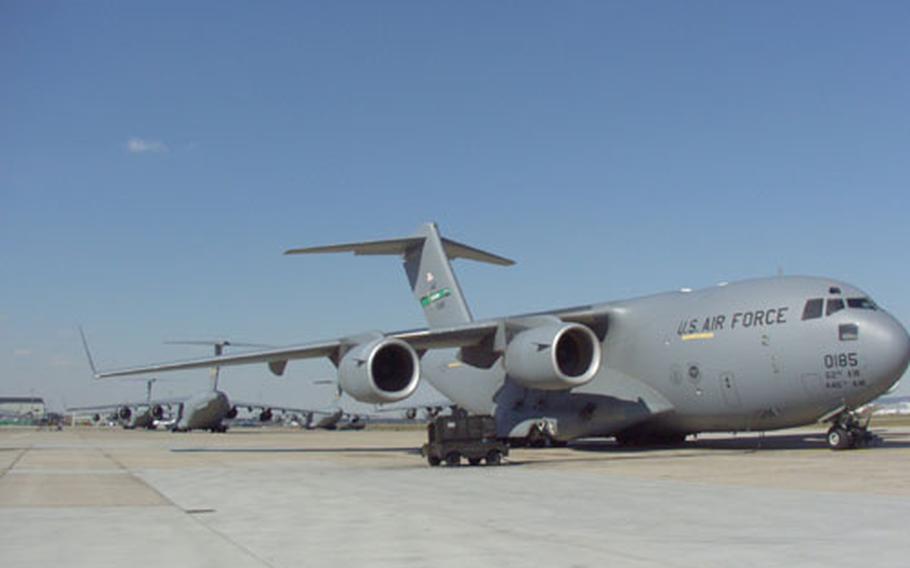 C-17 aircraft stack the flight line at Rhein-Main Air Base keeping squadrons busy preparing for missions in support of Operation Enduring Freedom and Operation Iraqi Freedom.