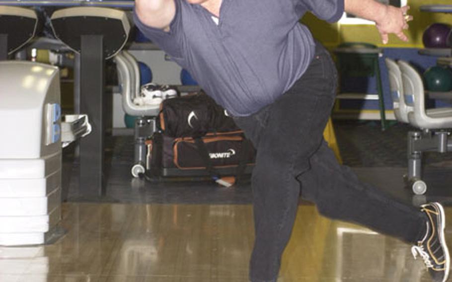 Staff Sgt. Svet Vukomanovich blasts in another strike at the Heidelberg bowling lanes. Administrative assistant to the Army’s top non-commissioned officer by day, Vukomanovich spends his spare time moonlighting as a professional bowler.