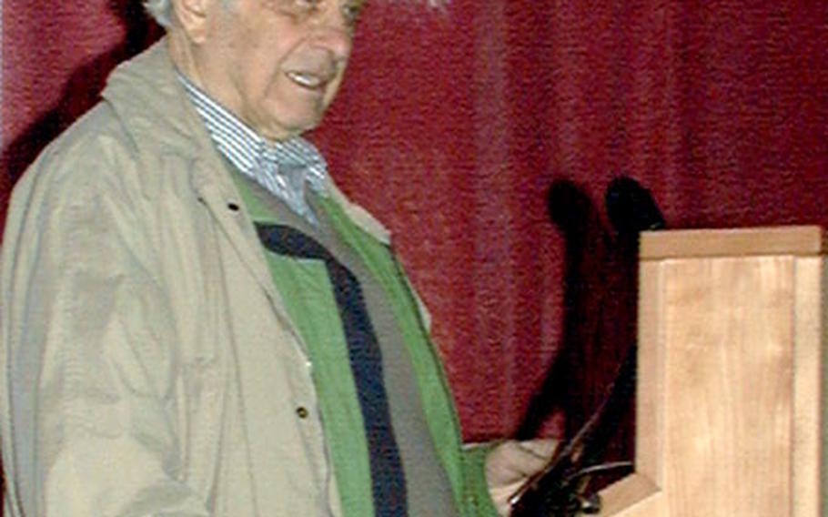Holocaust survivor Michael Walter speaks to about 100 people in Bamberg, Germany.
