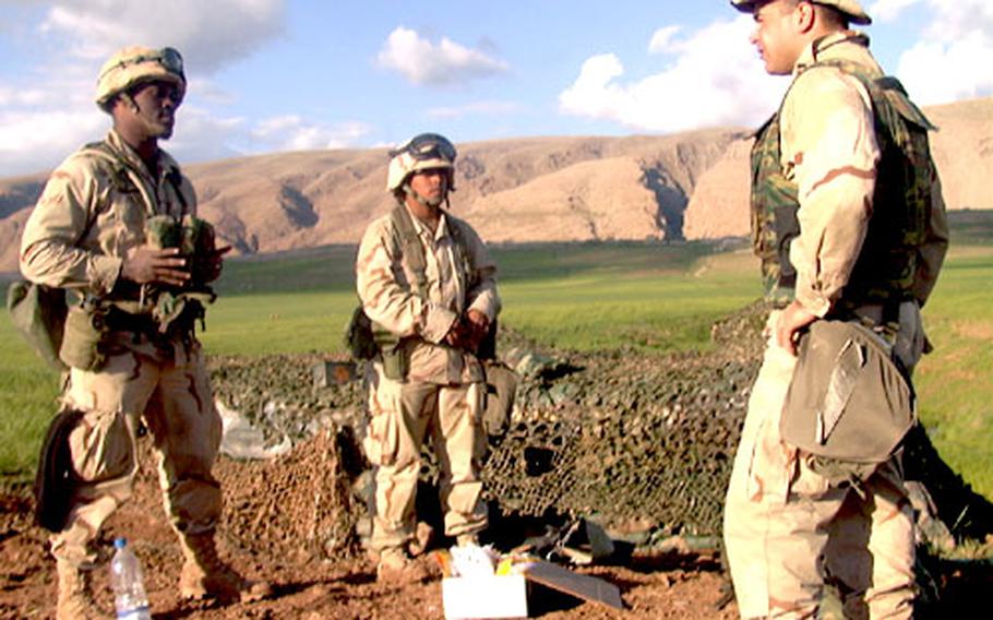 Twice a week, Air Force Capt. Oren Leff, right, visits airmen defending Bashur Airfield in northern Iraq. The lawyer typically brings a box of sweets and a list of possible security scenarios to test the decision-making processes of the young men and women who guard the base. On Thursday, Leff raised past and present rules-of-engagement situations with Airman 1st Class Phillip Polite, left, and Senior Airman Danielle Spencer