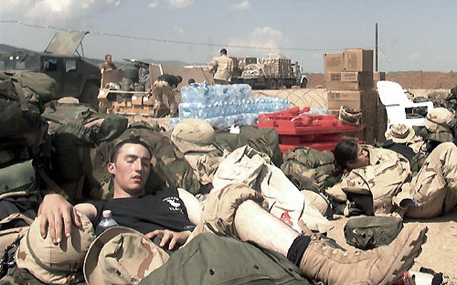 Airman 1st Class Justin Chakos, who had just gotten off the night shift, grabs some shuteye Tuesday morning while he and other Air Force cops prepare to redeploy to the city of Kirkuk south of Bashur Airfield. Chakos, who is normally assigned to the 52nd Security Forces Squadron, Spangdahlem Air Base, Germany, is attached for the Iraqi deployment to the 786th Security Forces Squadron, which is part of the 86th Expeditionary Contingency Response Group.