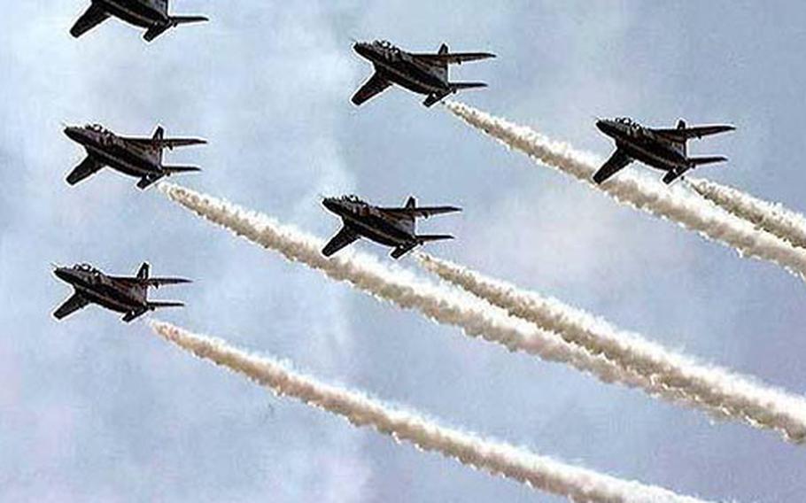 Jets from the Japanese Blue Impulse T-4 air demonstration team perform as part of Friendship Day 2001 at Iwakuni Marine Corps Air Station, Japan.