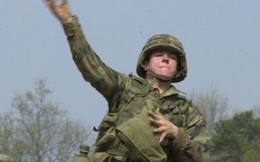 A 2nd Infantry Division soldier throws a grenade during Expert Infantryman's Badge training near Warrior Base in South Korea. To earn the Expert Infantryman's Badge, soldiers must complete 33 infantry specific tasks without failing.