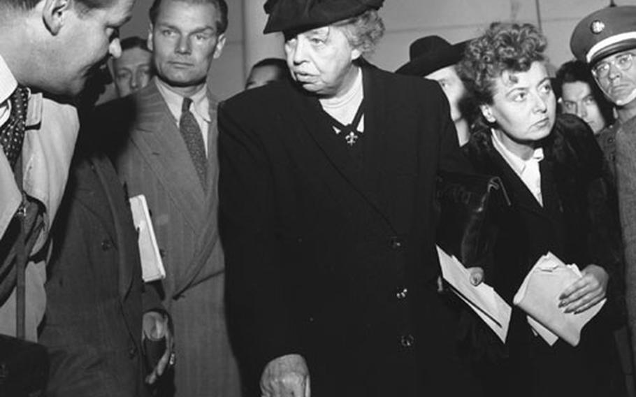 Former first lady Eleanor Roosevelt talks to workers in Stuttgart during her inspection tour of postwar Germany.