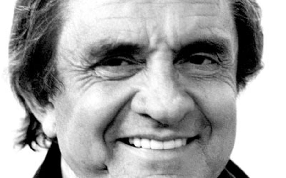 Johnny Cash poses backstage at Frankfurt, Germany, in April, 1988.