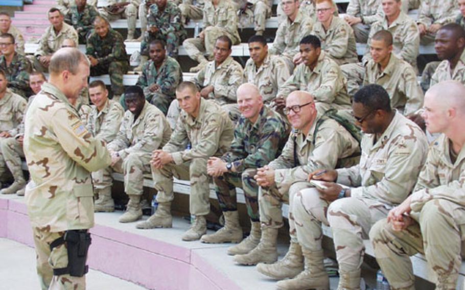 Gen. Martin E. Dempsey, commander of the Wiesbaden, Germany-based 1st Armor Division, talks in Baghdad on Aug. 9 to the "Bandits," the 1st Battalion of the 37th Armor. The temperature in the outdoor auditorium — which was partially shaded — was over 13O degrees.