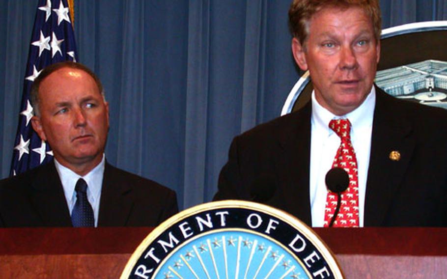 Sen. Tom Davis, R-Va., at the podium, and Rep. Pete Hoekstra, R-Mich., in August completed a three-day tour of Iraq in which they visited Baghdad, Tikrit, Kirkuk and Mosul. Seeing the mass graves, or "killing fields," as Davis called them, was the most startling part of the trip for Davis.