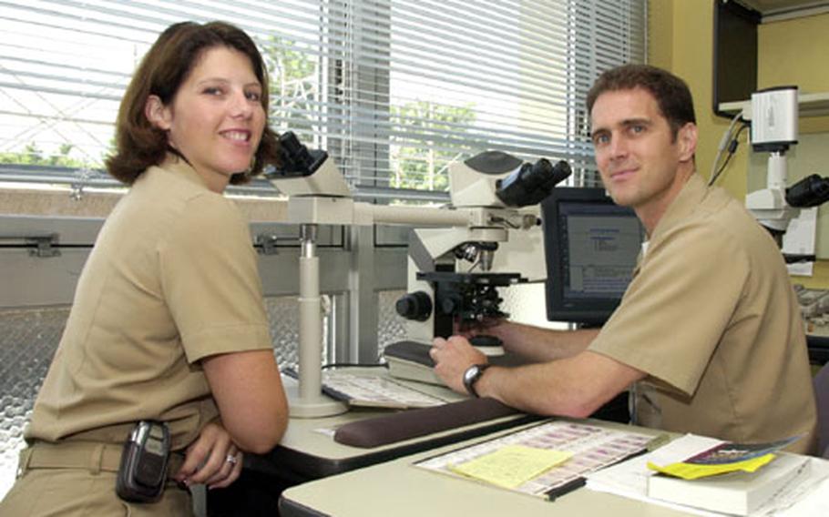 Lt. Cmdr. Lori Rogers and Lt. Cmdr. David Burch, both physicians at U.S. Naval Hospital Yokosuka, arrived recently and will head up the Tumor Registry Clinic at the hospital on Yokosuka Naval Base.
