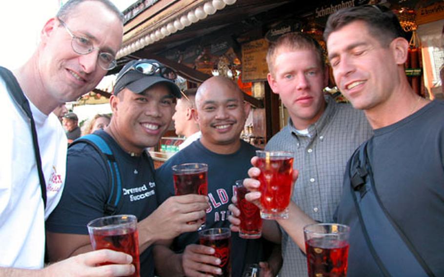 Enjoying the Durkheimer-Wurstmarkt on Saturday were, from left, Maj. Craig Short of Arcadia, Calif., and the 29th Support Group; Capt. Oliver Soria of Davis, Calif., and Landstuhl Regional Medical Center; Duane Marapao, a firefighter from Sacramento, Calif.; 1st Lt. Kyle Wickenheiser of Olean, N.Y., and the 191st Ordnance Battalion; and Lt. Col. Luigi Biever of Verona, Italy, and the 29th Support Group.