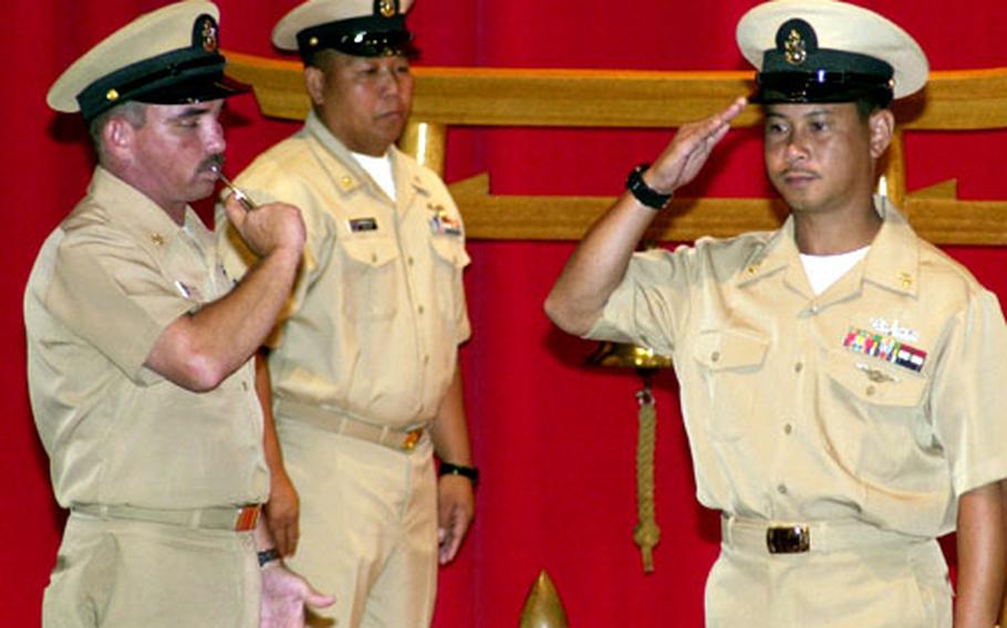 Chief Petty officer Leomarco Palaganas is "piped aboard" as a Chief Petty Officer at Yokosuka Naval Base.
