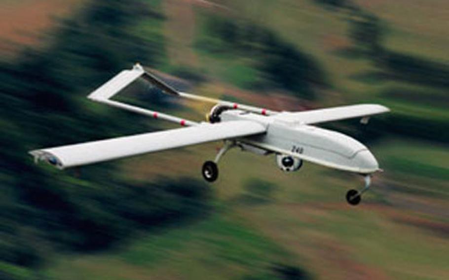 A Shadow 200 is shown flying in this photo.