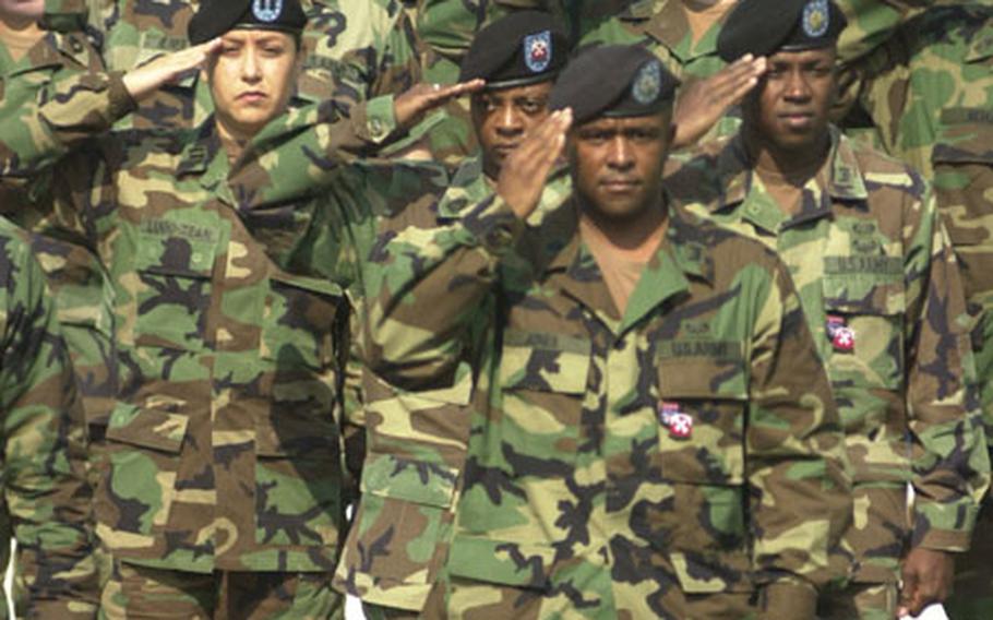 Soldiers salute Friday during a U.S. Forces Korea honor guard ceremony to commemorate National Prisoners of War/Missing In Action Recognition Day.