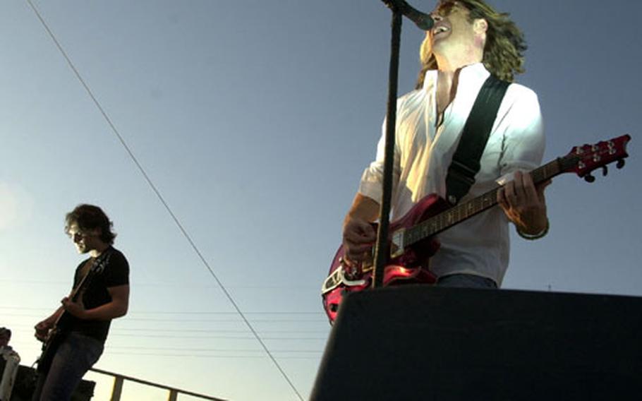 Collective Soul lead singer Ed Rowland, right, and lead guitarist Joel Kosch perform at Friday's 50th anniversary fiesta at Naval Station Rota in Spain. The concert also featured the Navy Sixth Fleet Band and Spanish flamenco dancers.