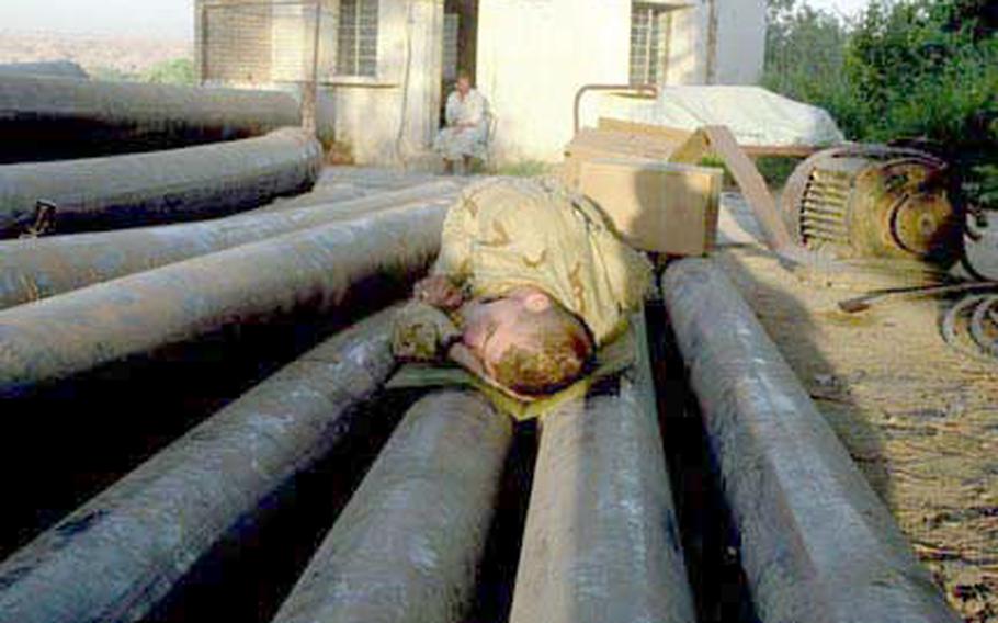 Soldiers with Company A, 1st Battalion, 508th Infantry Regiment sleep where they can at a patrol base near the Tigris River.