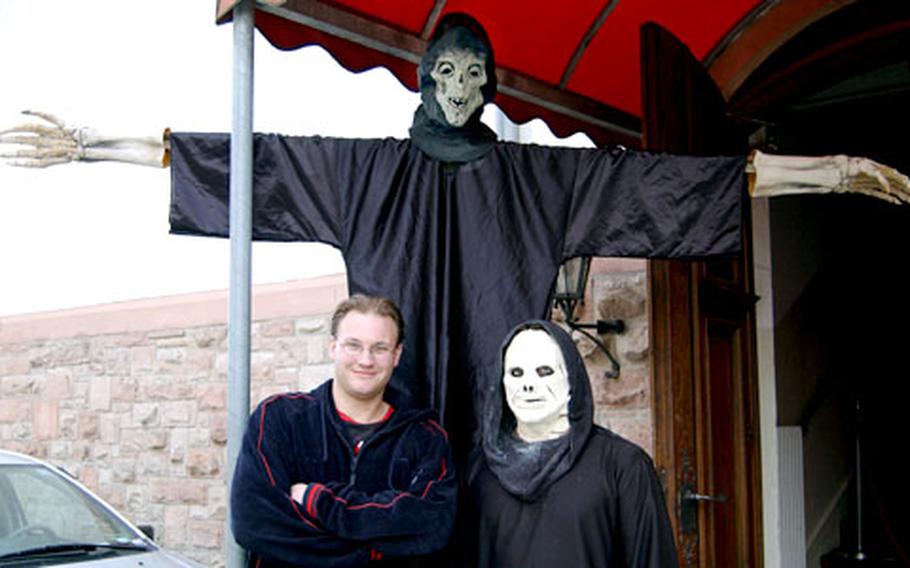 Spc. Todd Roberts, left, and Army dentist Capt. Jon Libbesmeier, in costume, pose for a photo last week after putting the finishing touches on the Babenhausen Haunted House.