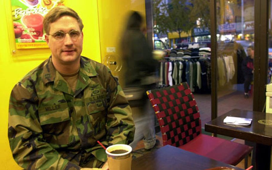 Capt. Dan Miller, a recovering alcoholic, enjoys his newest favorite beverage, coffee, in Itaewon.
