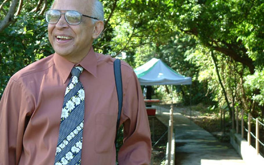 A. Naim Qazi, chief of the Environmental Flight of the 18th Civil Engineering Group, stands near the Ukumagi Bridge, which leads to the Iibaru Bijuru, a sacred prayer site recently restored on Kadena Air Base.