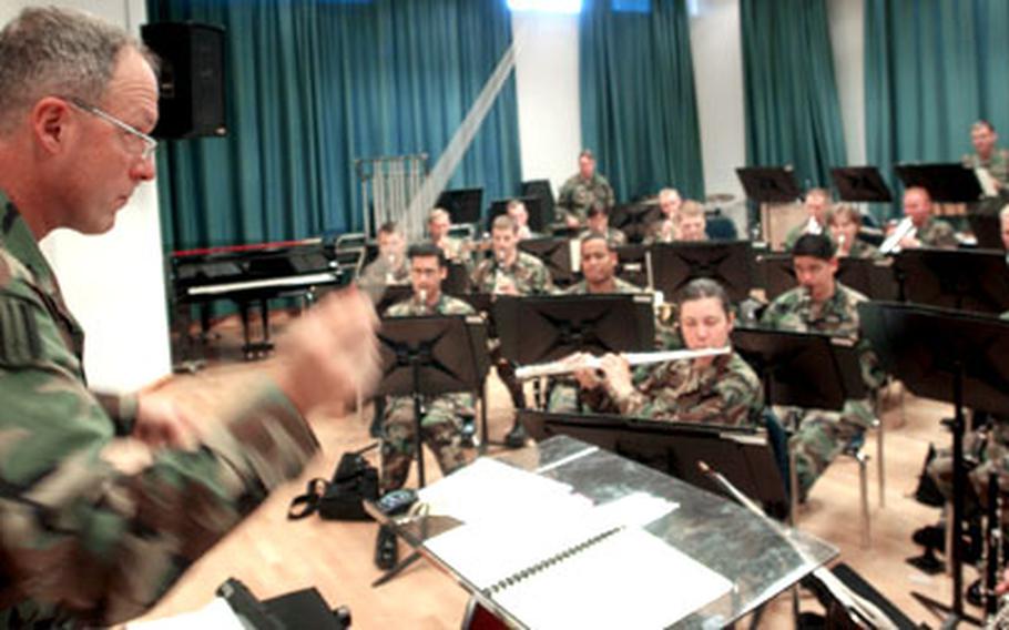Lt. Col. Tom Palmatier conducts the U.S. Army Europe Band’s rehearsal Monday at Tompkins Barracks in Schwetzingen, Germany, on Monday. Palmatier, commander of the USAREUR Band and Chorus, is preparing the men and women for their upcoming holiday concert series, “The Most Wonderful Time of the Year,” which opens Tuesday in Wiesbaden, Germany.