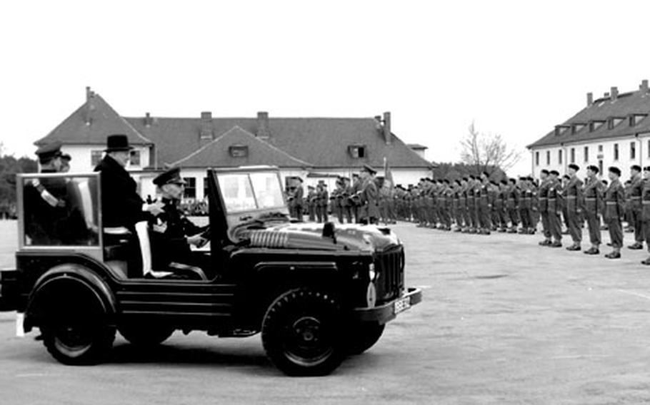 Former British Prime Minister Sir Winston Churchill reviews his old regiment, the 4th Queen's Own Hussars, at Hohne, West Germany, in May, 1956.
