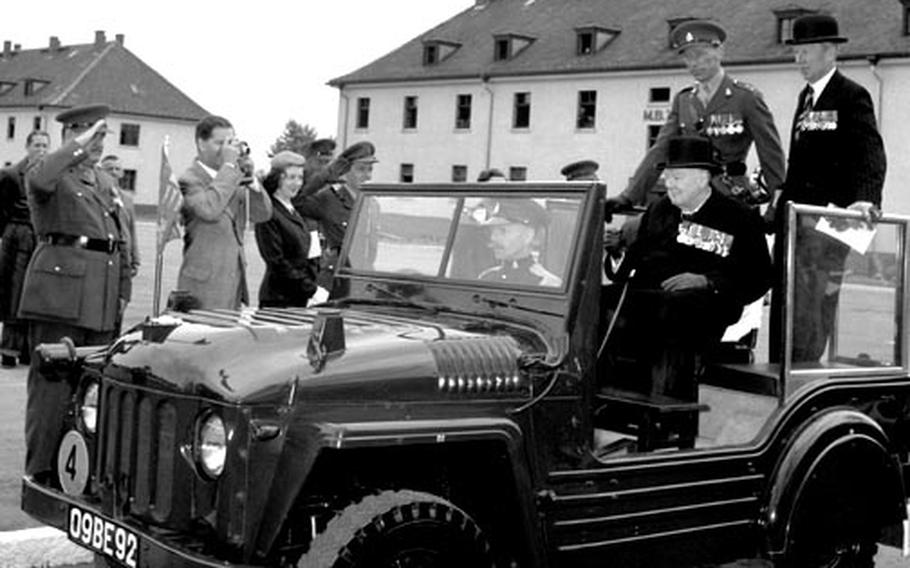 Former British Prime Minister Sir Winston Churchill reviews his old regiment, the 4th Queen's Own Hussars, at Hohne, West Germany, in May, 1956.