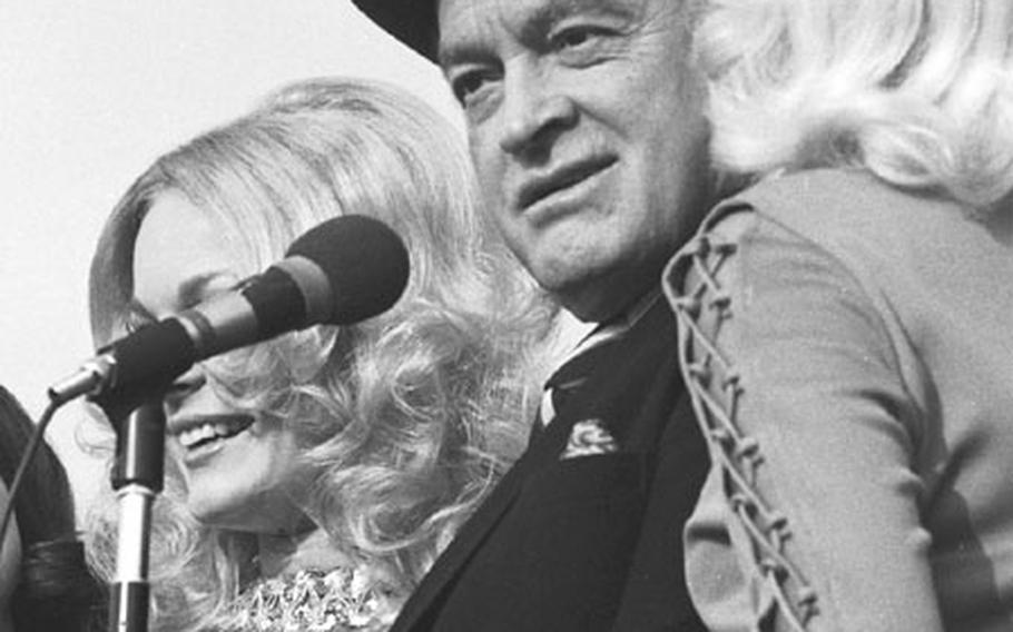 Bob Hope with a couple of the ''American Beauties'' at Yokota.