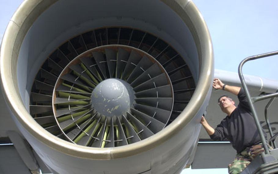 Air Force Tech Sgt. Ernest Pena works on a C-5 cargo aircraft at Morón Air Base in Spain. The base is bracing for an influx of planes and personnel due to the rotation of forces in Kuwait and Iraq in the next several months.