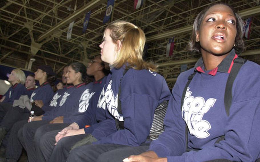 Senior Airman Takeesha Washington-Nash, a Tops In Blue vocalist and weapons loader with the 18th Aircraft Maintenance Squadron, Kadena Air Base, sits through a Tops In Blue briefing Wednesday morning prior to the New Year's Eve show at Misawa Air Base, Japan.