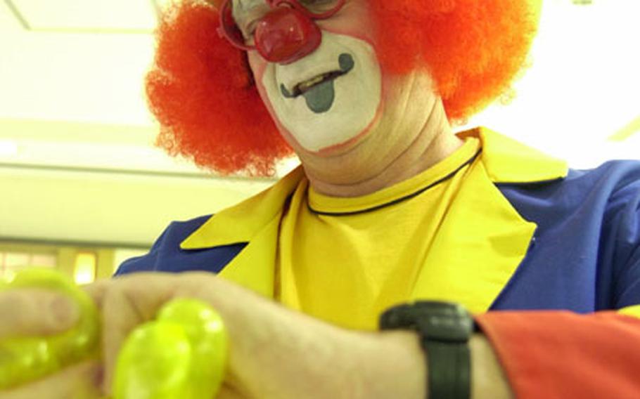 Dick Haun dresses up as a clown in Ikebukuro and entertains children at a shopping mall with balloon animals to celebrate the New Year.