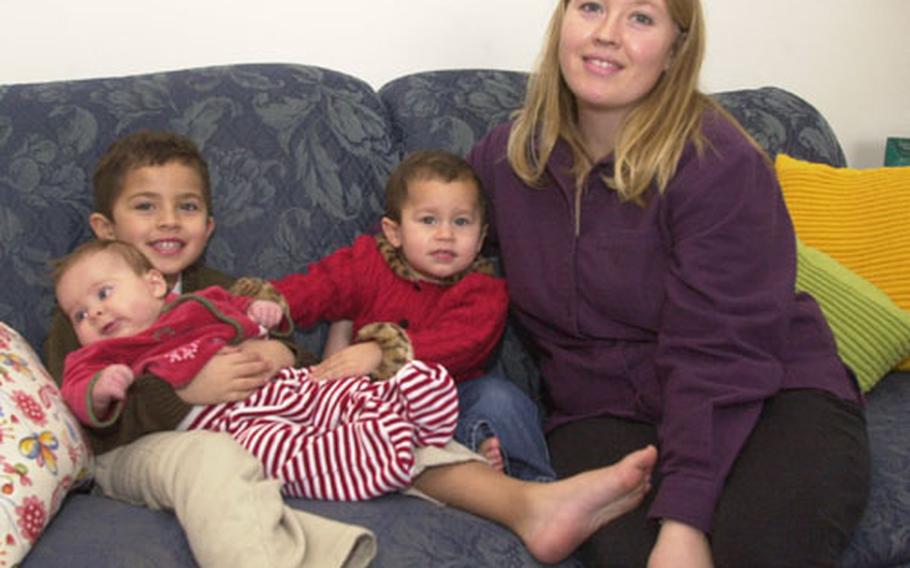 Stephanie Espinosa poses with her children, from left, Ian, 4, Gabriela, 3 months, and Maya, 2. While long periods of separation from her husband, Spec. Ricardo Espinosa, are tough, there are also perks to Army life, such as living in Europe and the family's vacation last summer to Majorca.