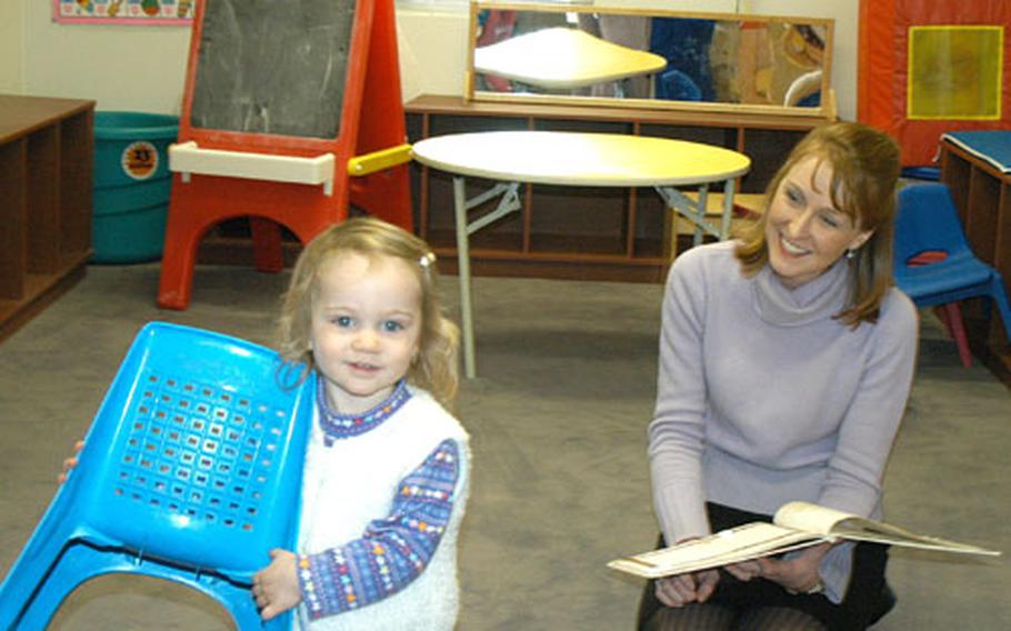 Wendy Gade and her one-year-old daughter, AnnaGrace, enjoy the recently revamped Camp Casey Pear Blossom Cottage.