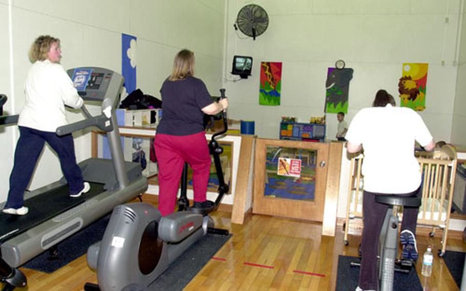Misawa Air Base moms exercise in the parent-and-toddler room at Potter Fitness Center on Wednesday. The room is one of several that will close for several weeks starting Monday while lights are replaced.