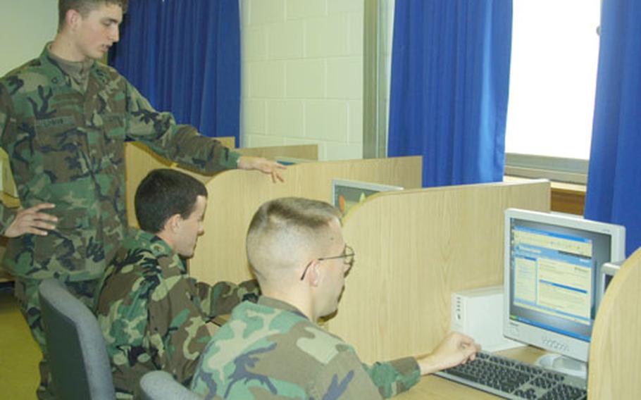 Soldiers of the 527th Military Intelligence Battalion at Zoeckler Station use one of the new Army Knowledge Online computer labs being established across the peninsula. Many of the labs will be open 24 hours a day, seven days a week to accommodate shift-workers, officials said.
