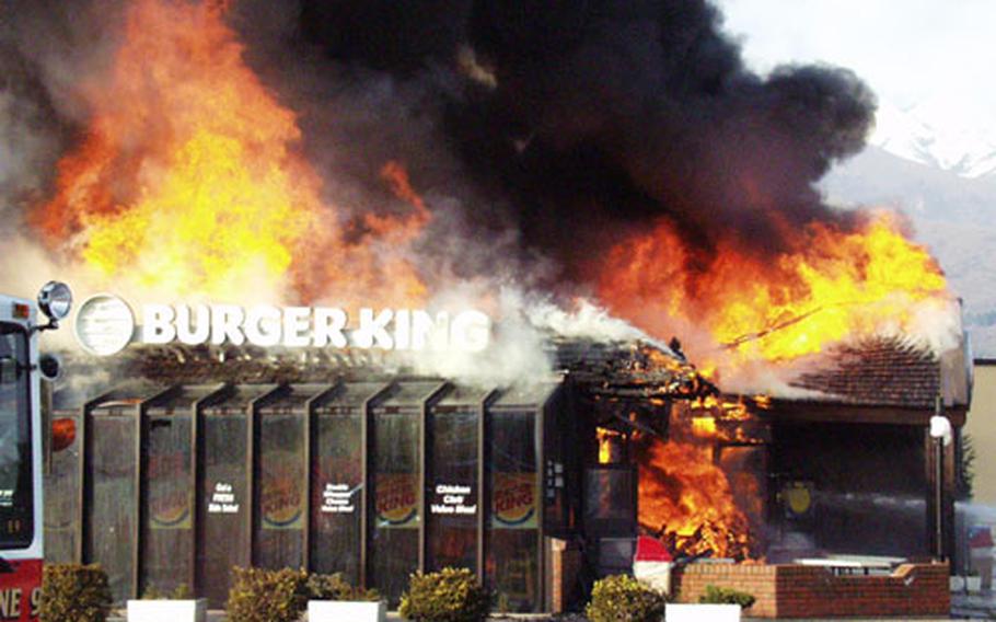 The Burger King building on Area 1 at Aviano Air Base went up in flames Monday afternoon. Much of the ceiling was already in flames by the time base firefighters arrived.
