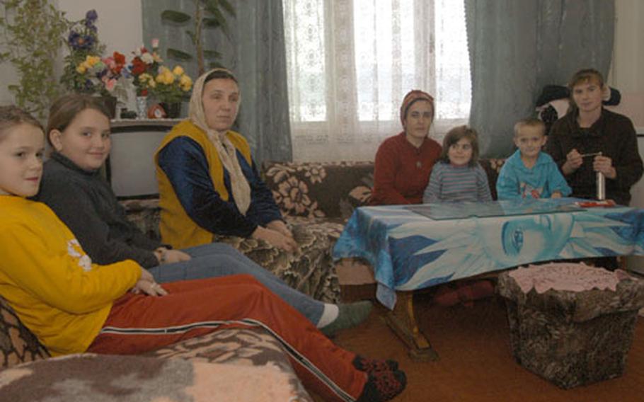 From left, Begajeta Ademovic, Refija Bajramovic and Galiba Muhic and their children have been living in a collective center with poor living conditions in a coal mining company building in Dolovi, Bosnia and Herzegovina, for more than two years. Local and international authorities have been running efforts to shut down all collective centers, and are faced with a challenge of finding a fitting alternative for the people living in them.