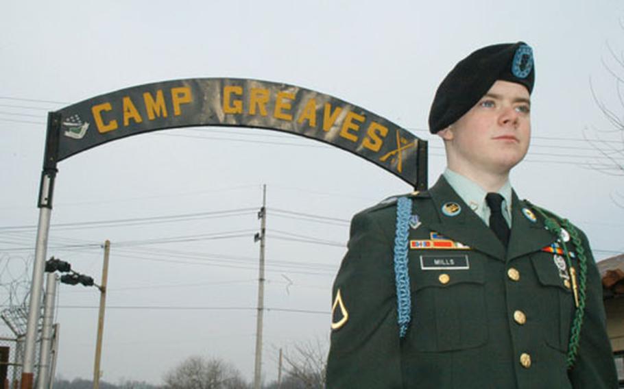 Private 1st Class Christopher Mills stands outside Camp Greaves on Friday.