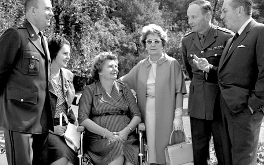 Mr. and Mrs. Walt Disney, Brig. Gen. and Mrs. Frederick O. Hartel and Brig. and Mrs. R.H. Whitworth in the Hartels' back yard in Berlin.