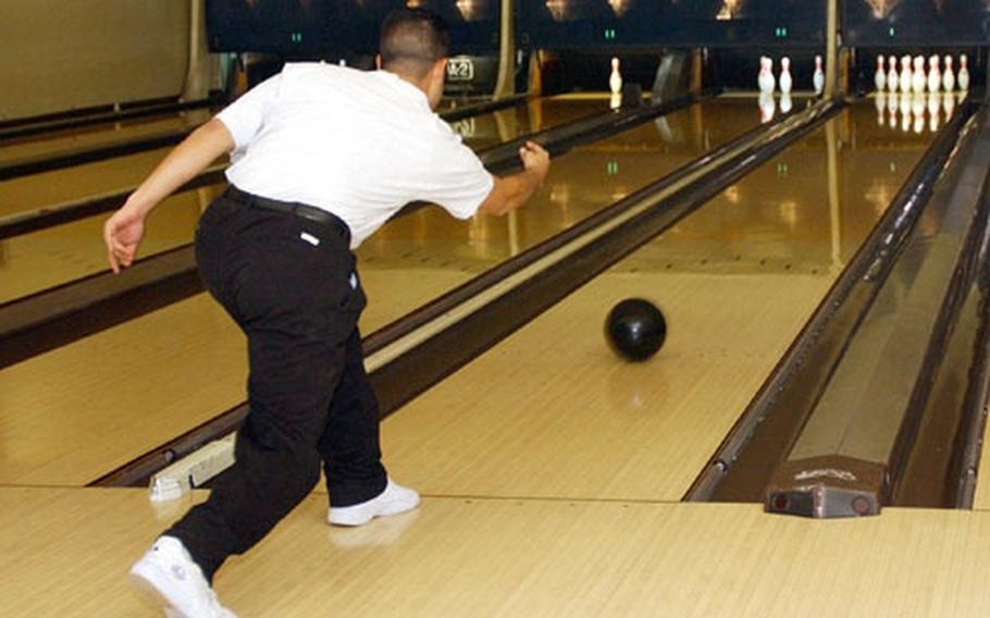 Iwakuni Marine Corps Air Station residents enjoy the evening at the Station Bowling Alley. Normal hours are until 11 p.m., but if patrons are still ready for a few more frames the bowling alley will stay open until midnight.