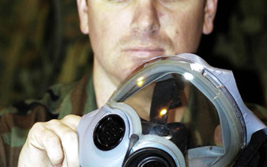 Petty Officer 3rd Class Jesse Adams, a Seabee, inspects equipment that will be added to his battalion’s new maintenance management system.