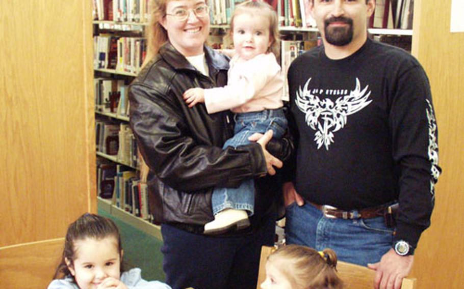 The Cook family is back together again. Sgt. Penny Cook spent five months in Iraq, returning only recently to Caserma Ederle in Vicenza, Italy. Her absence left Bill Cook to care for their three daughters: Kayley, 4, Cheyenne, 3, and Jasmine, 18 months.