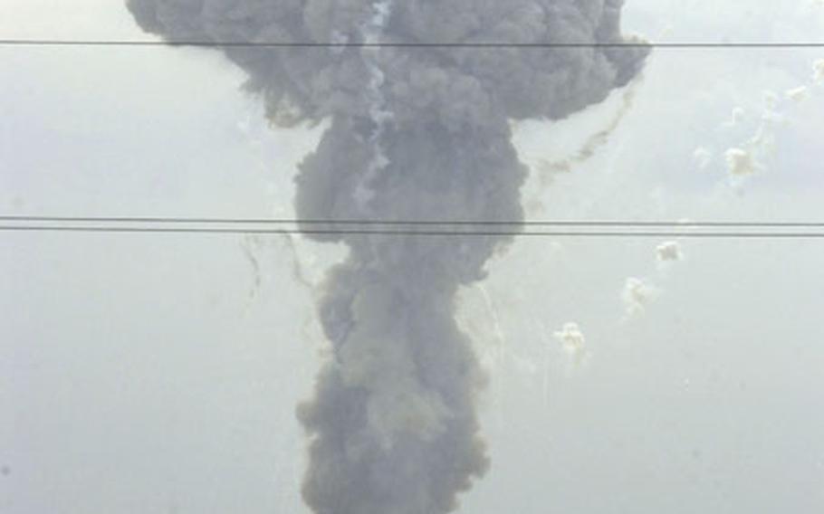 The detonation of 70 tons of Iraqi ordnance produces this mushroom-shaped cloud.