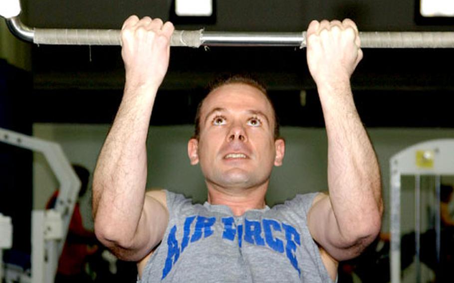 Maj. Steve LaCasse takes time during his lunch hour to work out at the north side gym at Ramstein Air Base, Germany. LaCasse said he’s excited about the Air Force’s new fitness program, which includes the elimination of weight and height standards.
