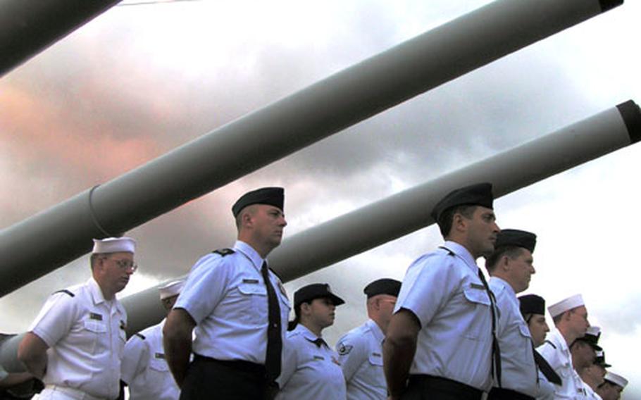 Exactly 60 years after the USS Missouri was launched from the Brooklyn Naval Shipyards, about 50 sailors, soldiers, airmen and Coast Guardsmen stood upon her deck in Pearl Harbor to reenlist and celebrate her birthday.