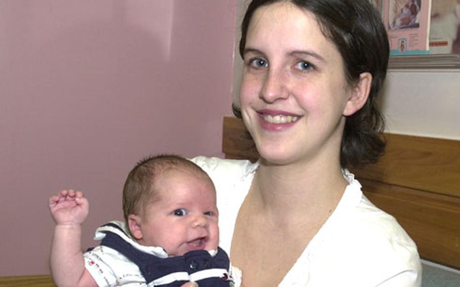 Sarah Schexnider, a military spouse at Misawa Air Base, Japan, holds son Asher, born Dec. 11 with severe anemia. Medical personnel at Misawa's base hospital pulled together to stabilize the sick baby until he was airlifted to the Neonatal Intensive Care Unit at Camp Lester, Okinawa.