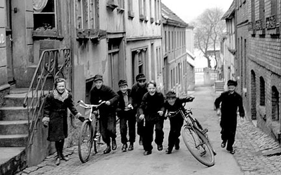 A group of kids in the once-again-peaceful town of Remagen, 1951.
