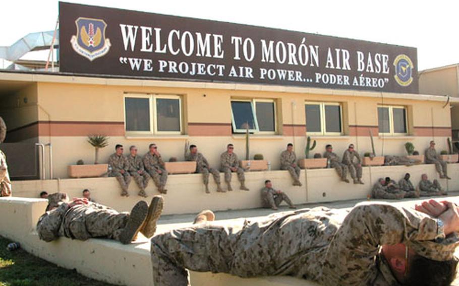 Members of Company K, 3rd Battalion, 2nd Marine Division from Camp Lejeune, N.C., try to relax on Feb. 4 after their eight-hour flight across the Atlantic. The Marines would leave for the east African nation of Djibouti in a few hours for duties there.