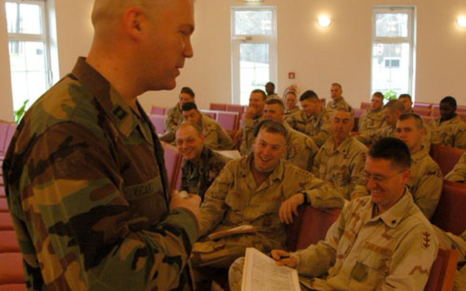 Soldiers from the 94th Engineer Battalion in Vilseck, Germany, listen as Chap. (Capt.) Cliff Vicars discuss ways to avoid stress upon their return from a yearlong deployment to Iraq.