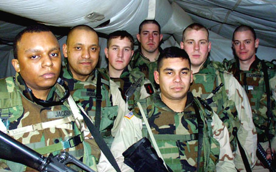 A routine ferry flight from Nuremberg, Germany, to Kuwait City, turned frightening for members of Troops B and C of the 1st Squadron, 4th U.S. Cavalry. The World Airways DC-10 suffered an engine fire. Soldiers on the flight included, from left, Spc. Orin Jackson, Staff Sgt. Willy Mora, Spc. Christopher Neff, Pfc. Justin Patterson, Cpl. Robert Reyna, Pfc. Patrick Rice and Staff Sgt. Peter Caruana.