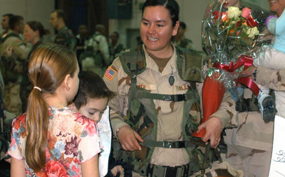 Spc. Pamela Smith, one of about 150 soldiers from 5th Battalion, 158th Aviation Regiment to return from a one-year deployment to Iraq on Wednesday.